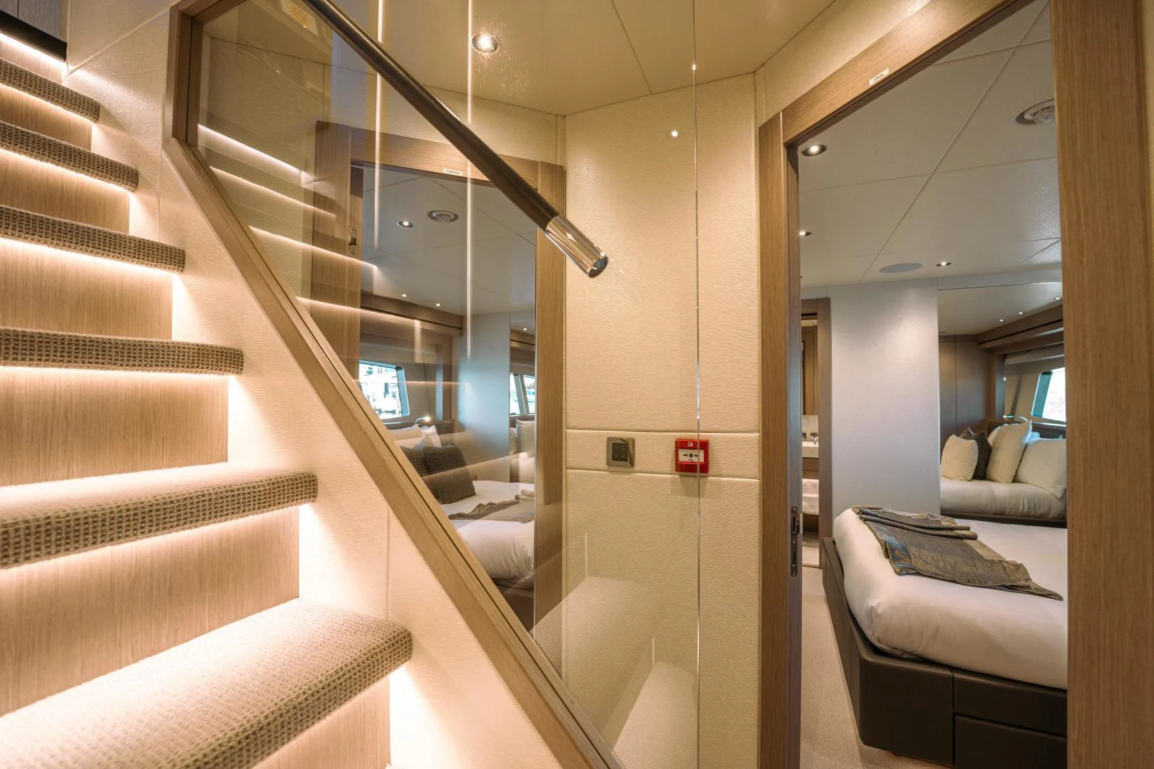 a hallway with a glass door aboard EOS Yacht for Sale
