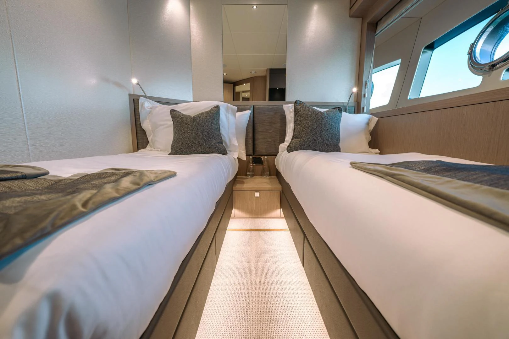 a room with two beds aboard EOS Yacht for Sale