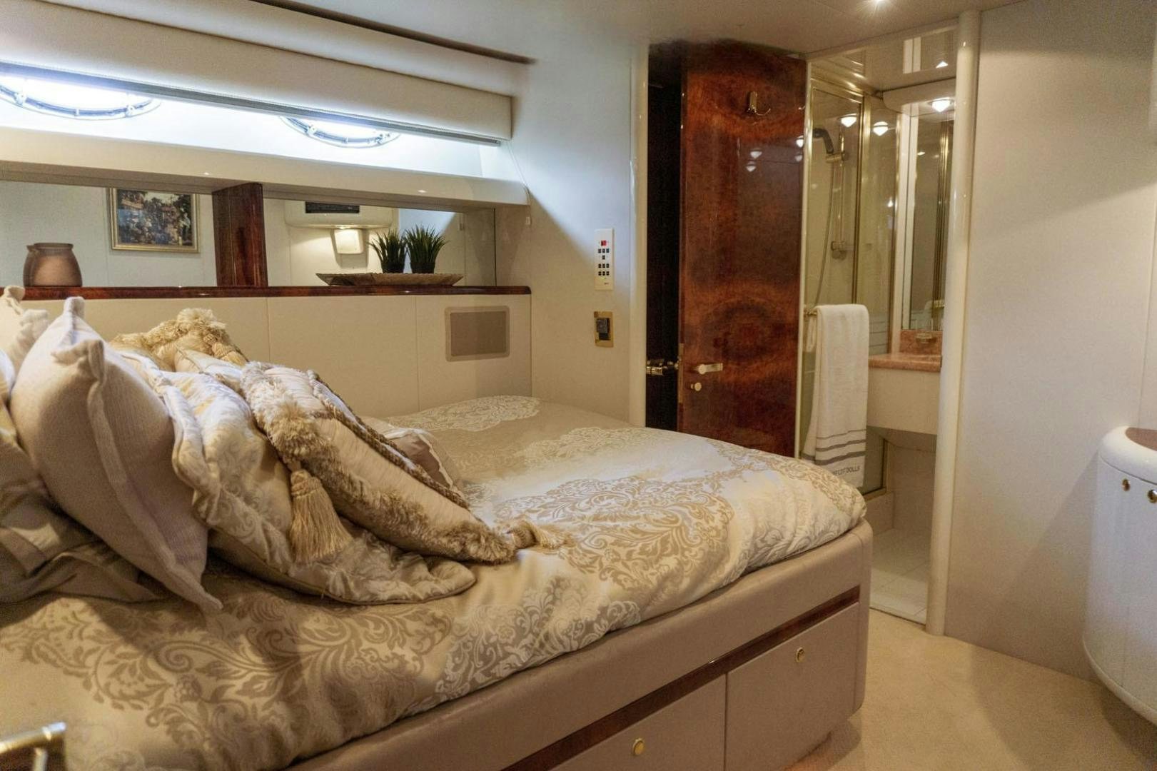 a bed with a white sheet aboard MAGNIFICENT DOLLS Yacht for Sale
