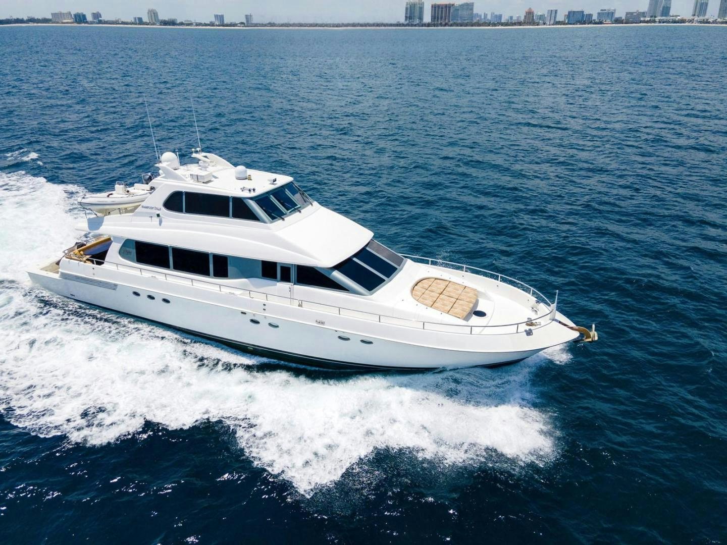 a white yacht on the water aboard MAGNIFICENT DOLLS Yacht for Sale