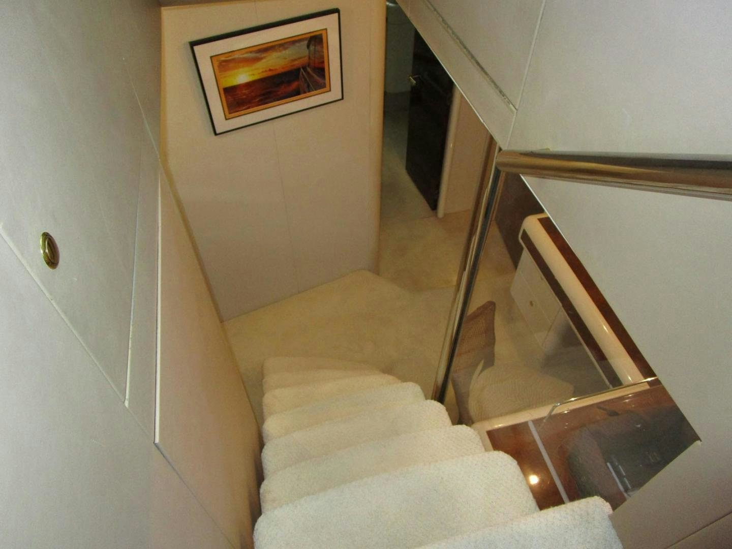 a staircase with a white couch aboard MAGNIFICENT DOLLS Yacht for Sale