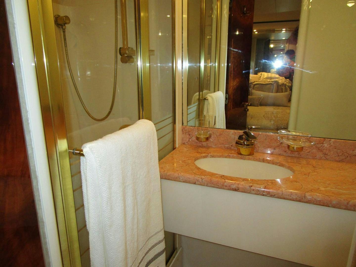 a bathroom with a sink and a mirror aboard MAGNIFICENT DOLLS Yacht for Sale