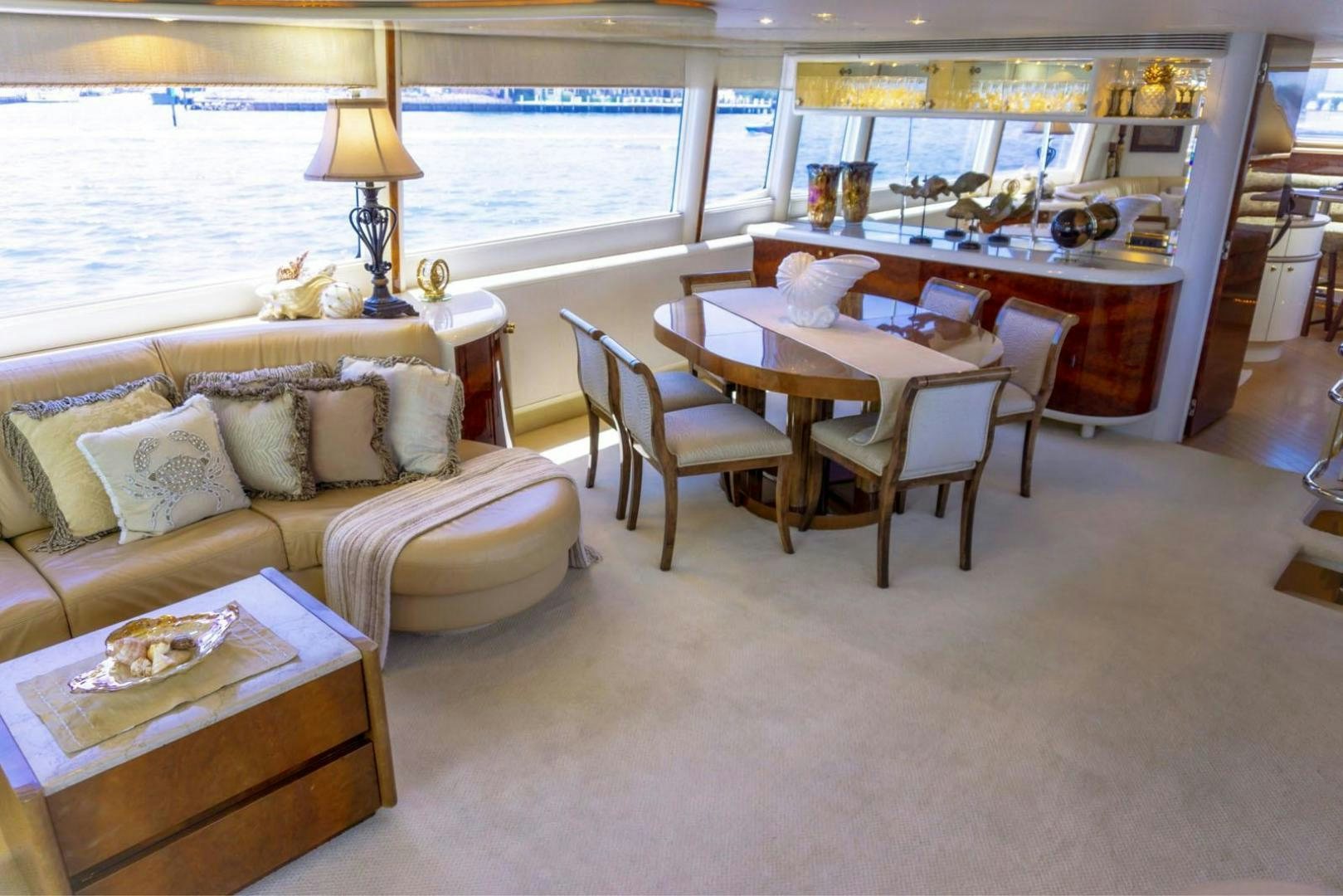 a living room with a couch and a table aboard MAGNIFICENT DOLLS Yacht for Sale