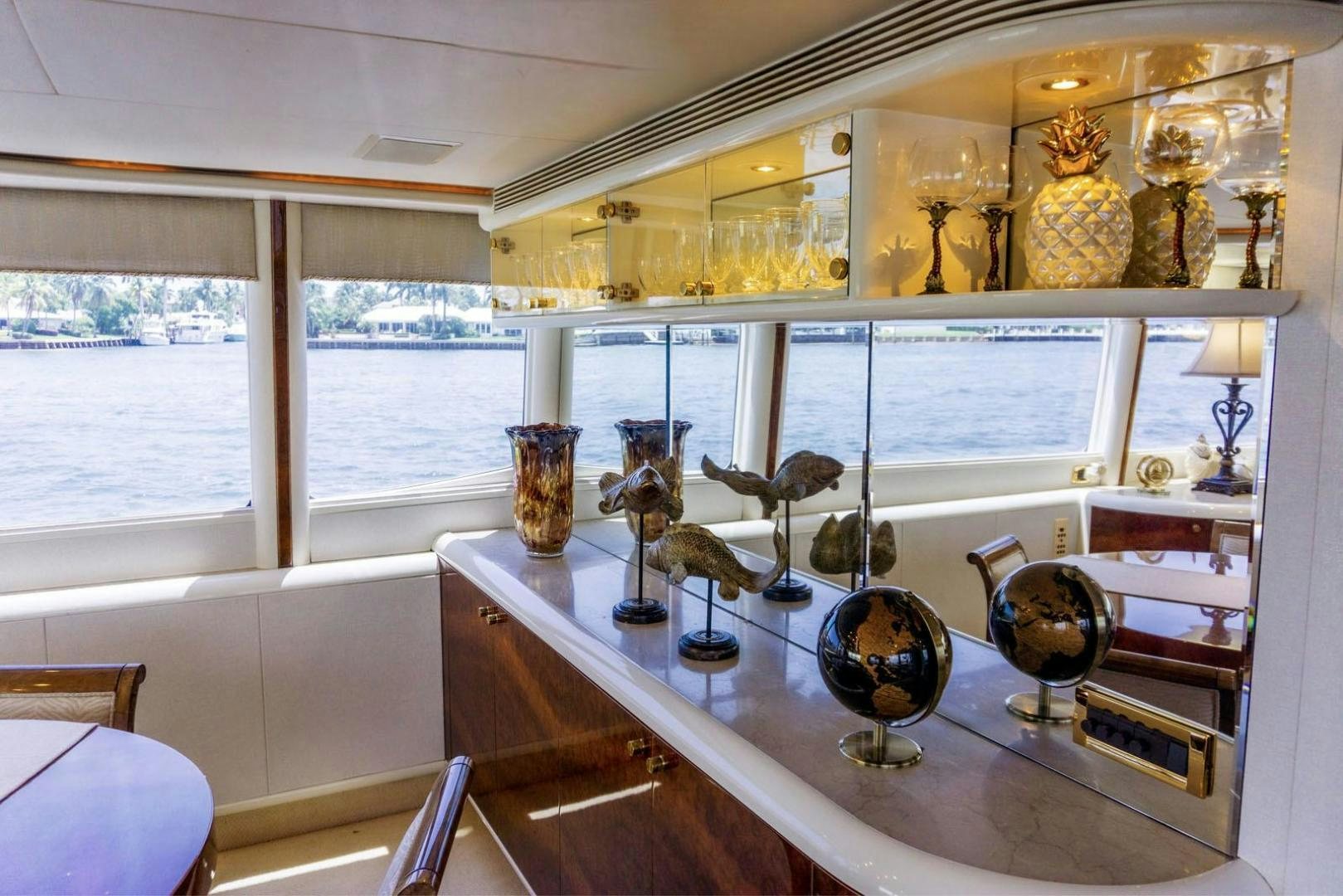 a table with many vases on it aboard MAGNIFICENT DOLLS Yacht for Sale