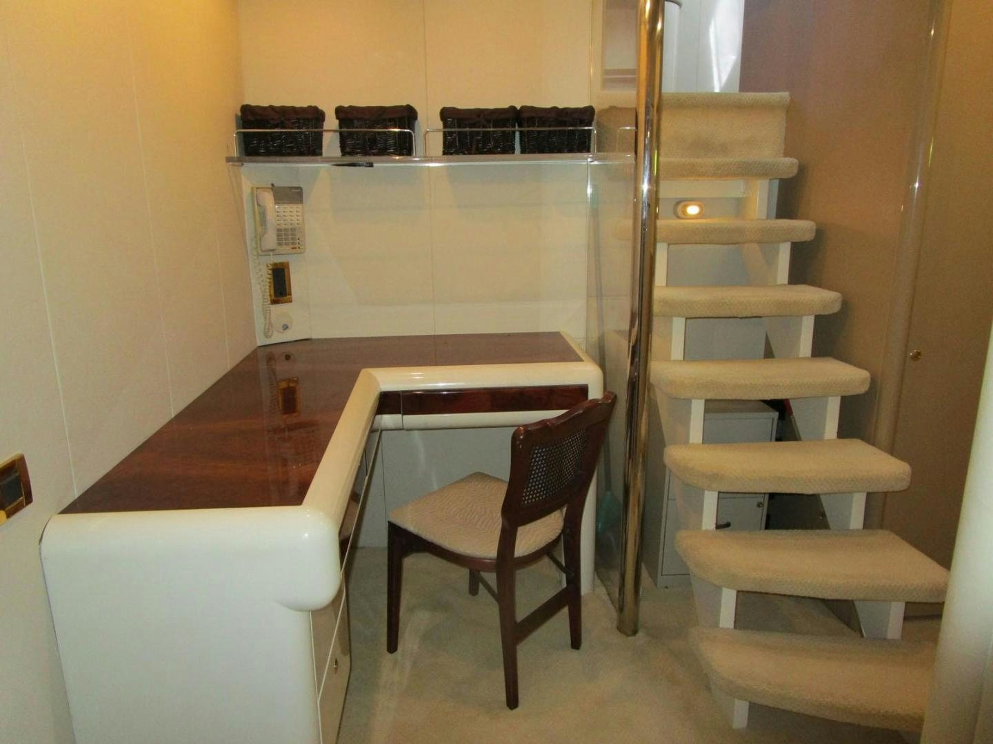 a small table and chairs aboard MAGNIFICENT DOLLS Yacht for Sale