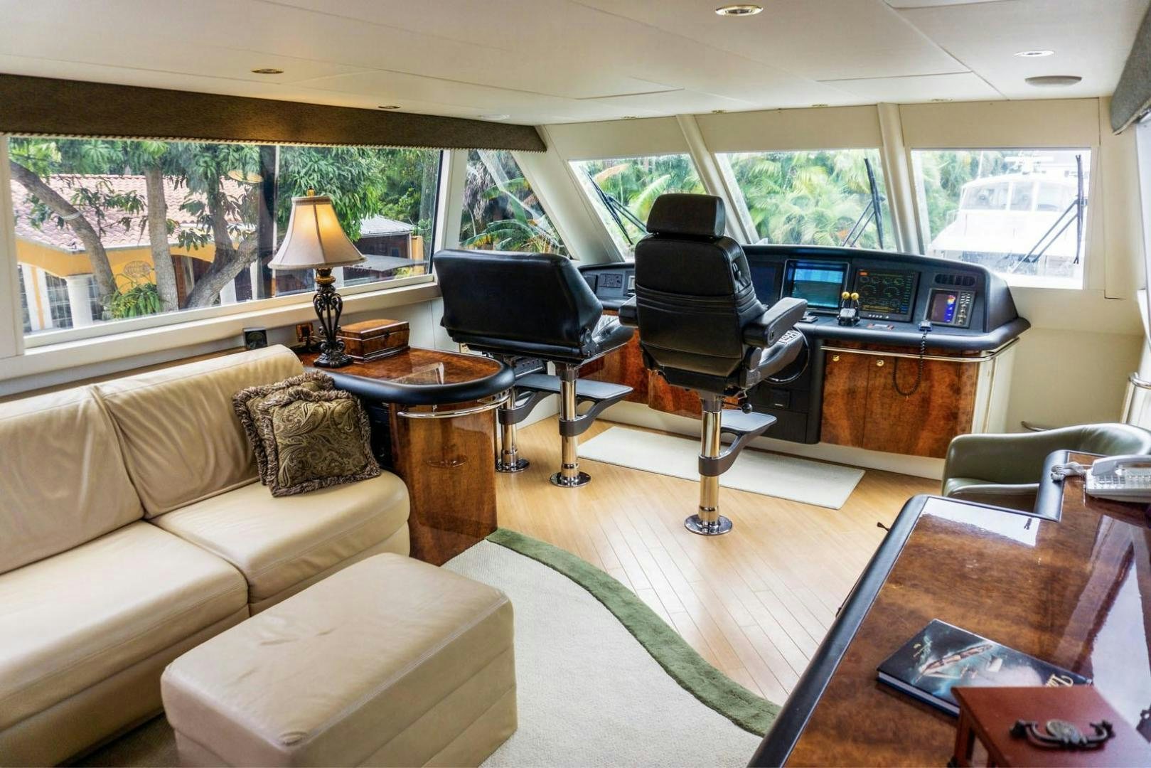 a living room with a couch and a television aboard MAGNIFICENT DOLLS Yacht for Sale