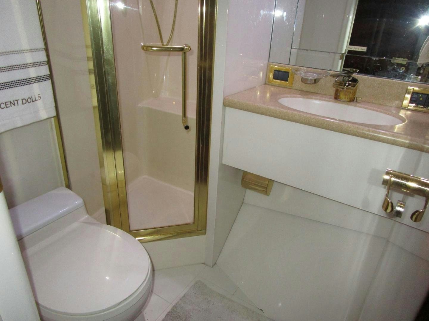 a bathroom with a glass shower aboard MAGNIFICENT DOLLS Yacht for Sale
