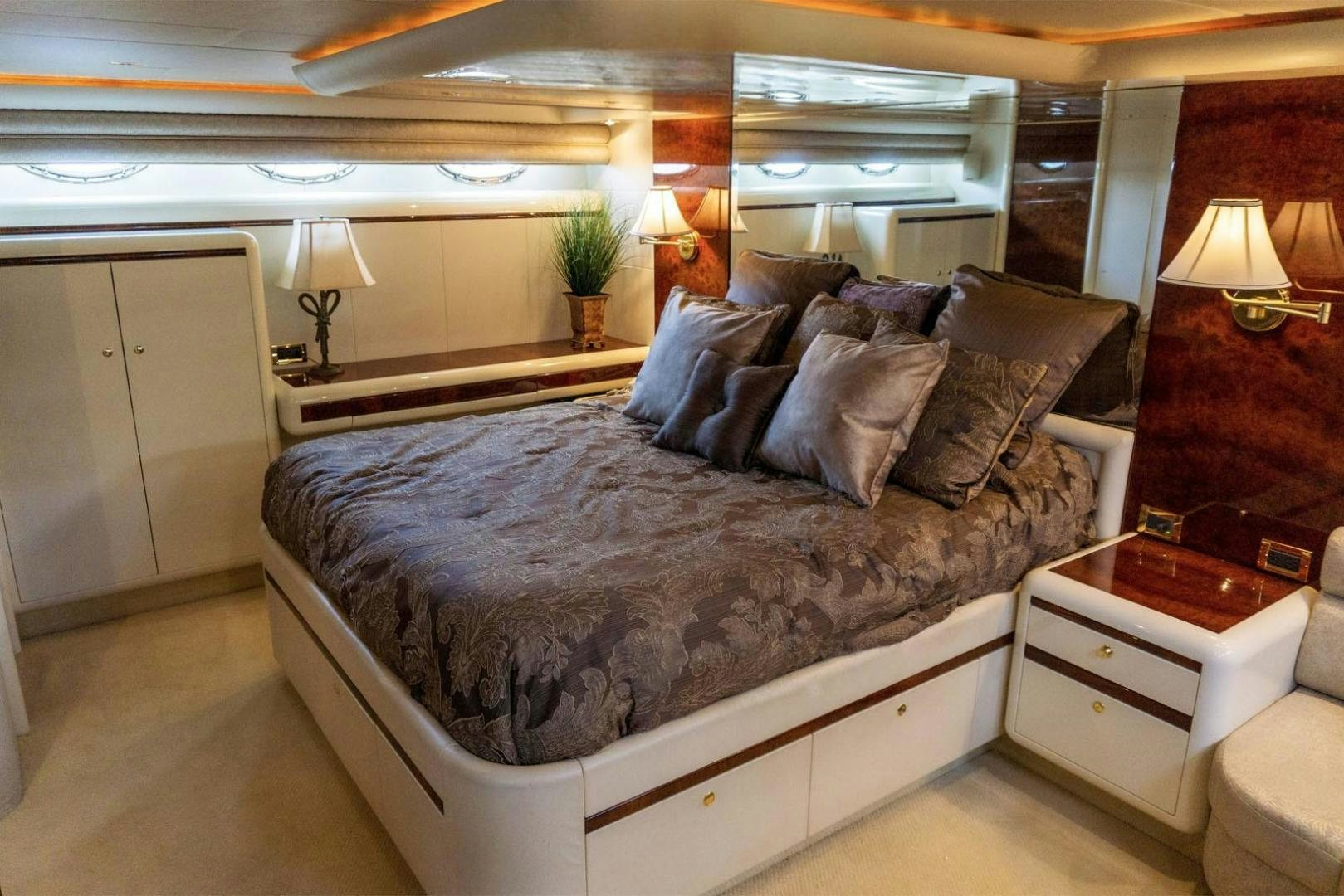 a bed with a large bed aboard MAGNIFICENT DOLLS Yacht for Sale