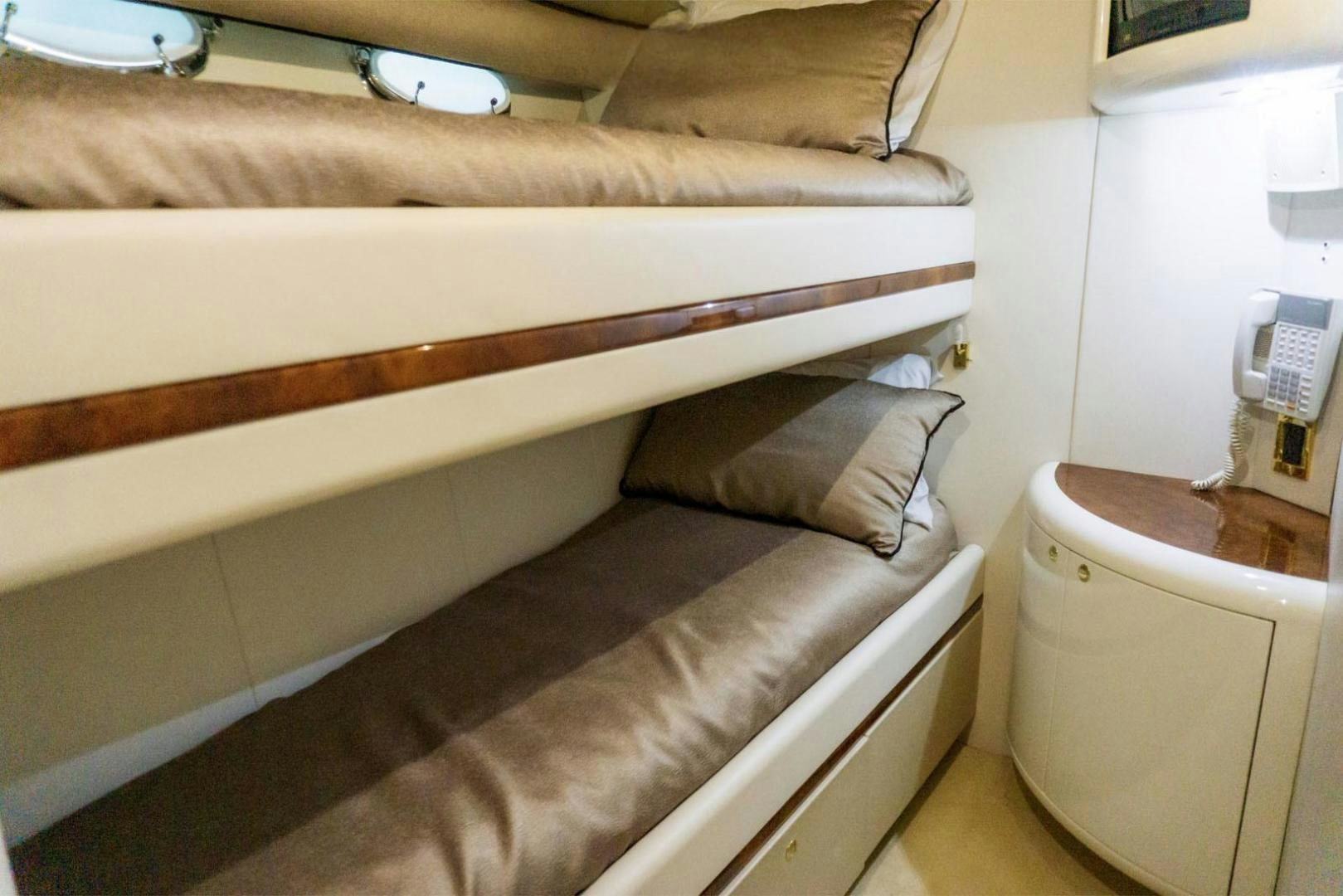 a bed with a wooden frame aboard MAGNIFICENT DOLLS Yacht for Sale