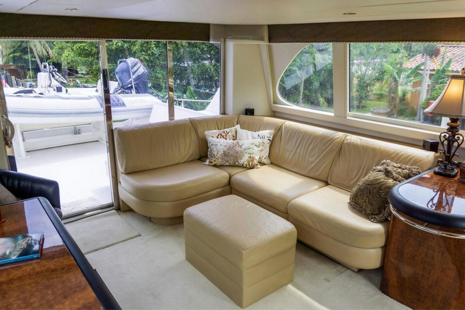 a living room with a couch and a table aboard MAGNIFICENT DOLLS Yacht for Sale