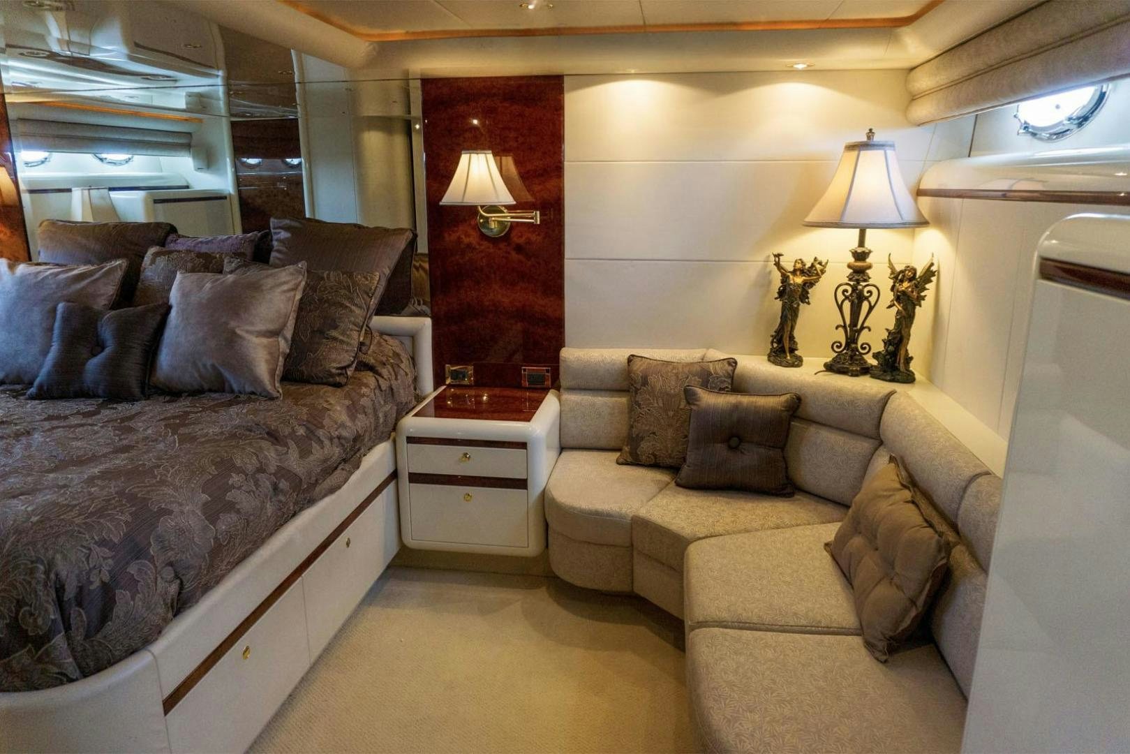 a living room with a couch and a lamp aboard MAGNIFICENT DOLLS Yacht for Sale