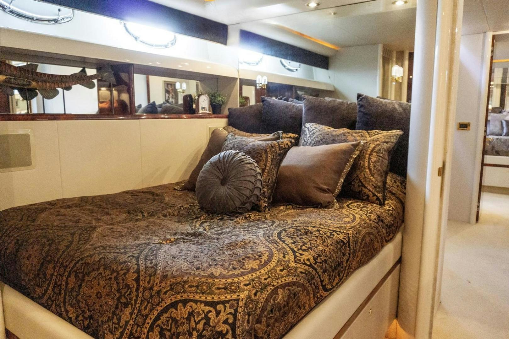 a couch with pillows aboard MAGNIFICENT DOLLS Yacht for Sale