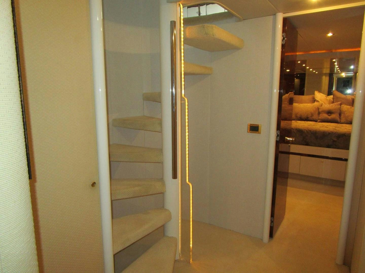 a room with a staircase and a glass door aboard MAGNIFICENT DOLLS Yacht for Sale