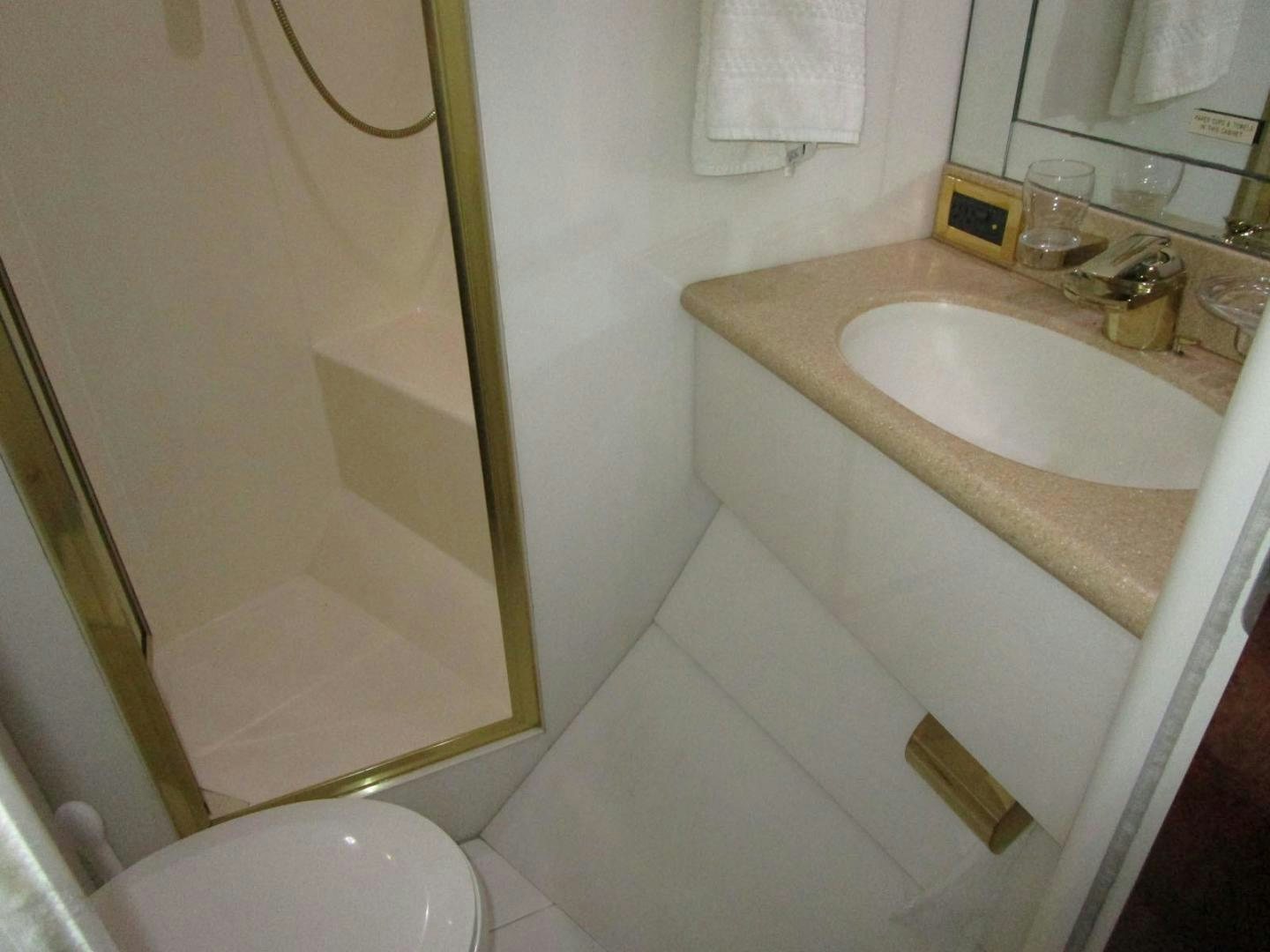 a bathroom with a sink and toilet aboard MAGNIFICENT DOLLS Yacht for Sale