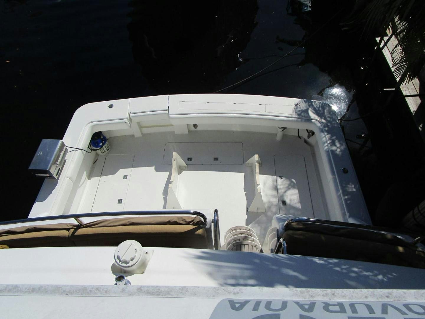 a white car with a surfboard aboard MAGNIFICENT DOLLS Yacht for Sale