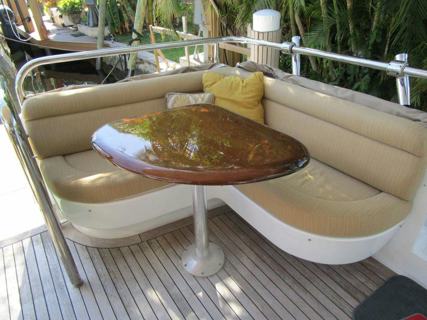 a wooden table with a bowl of food on it aboard MAGNIFICENT DOLLS Yacht for Sale