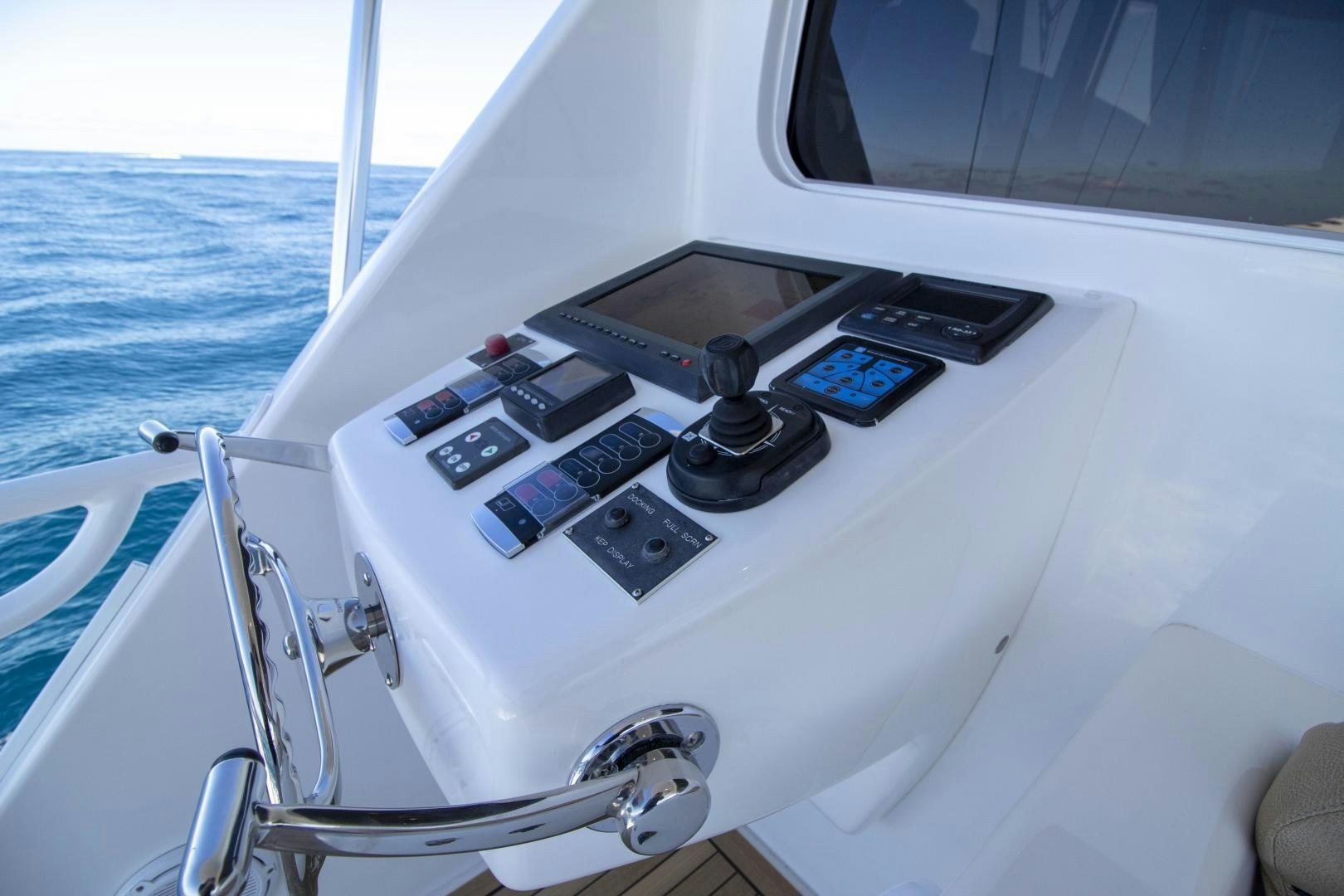 a boat with a steering wheel and a remote control on the front aboard VICTORY Yacht for Sale