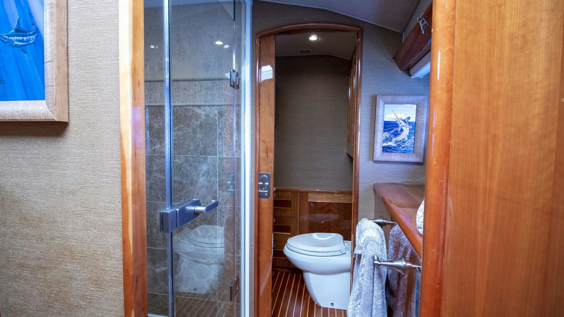 a bathroom with a glass shower aboard VICTORY Yacht for Sale