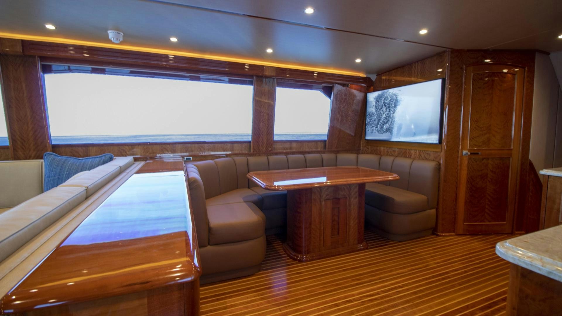 a room with a table and chairs aboard VICTORY Yacht for Sale
