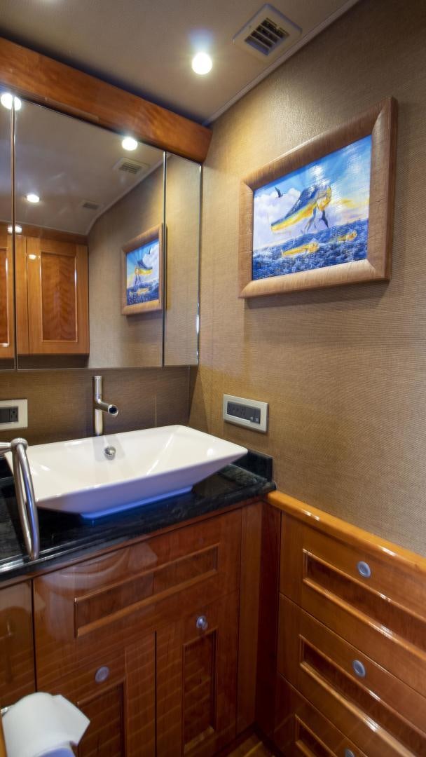 a bathroom with a large mirror aboard VICTORY Yacht for Sale
