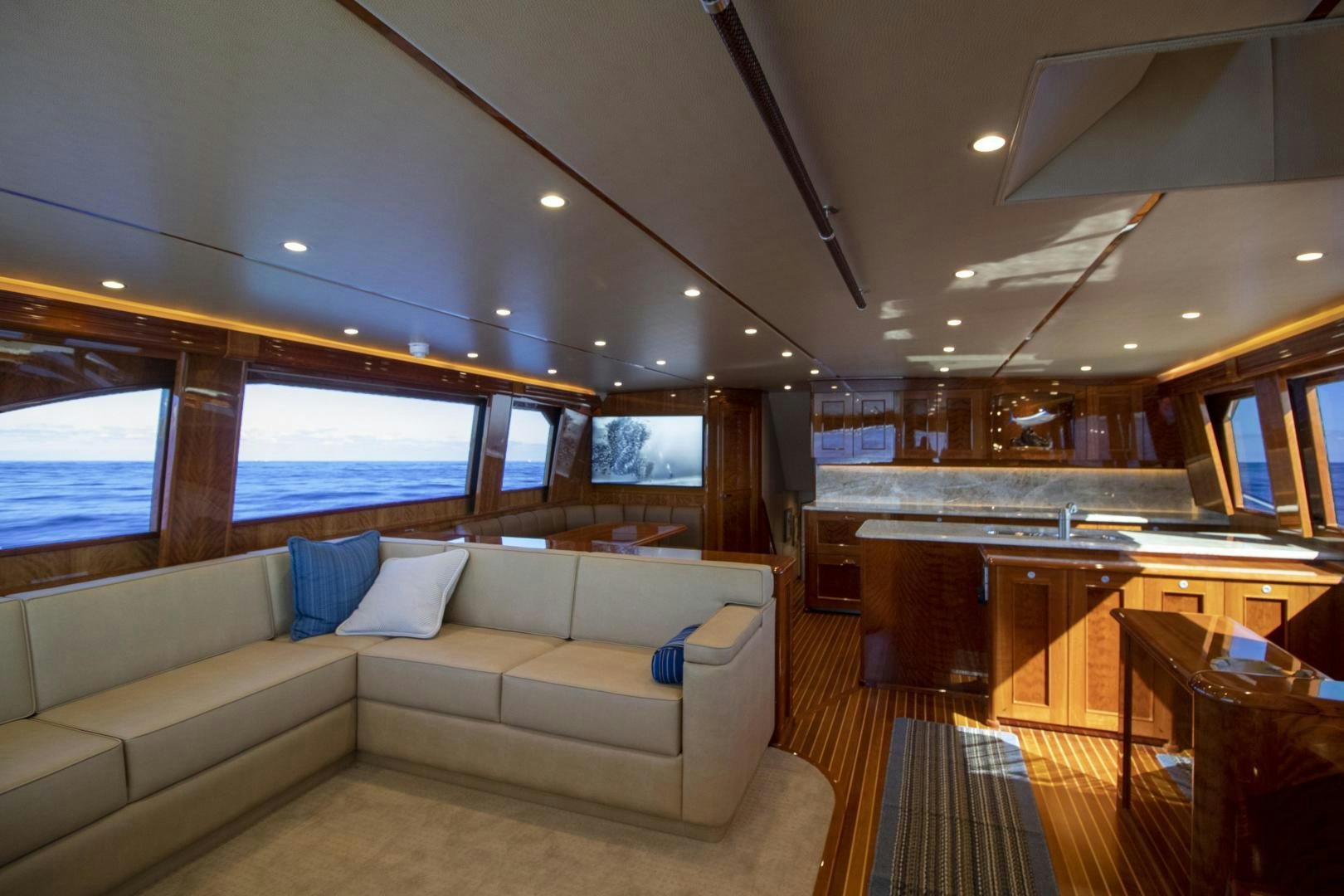 a living room with a couch and a large window aboard VICTORY Yacht for Sale