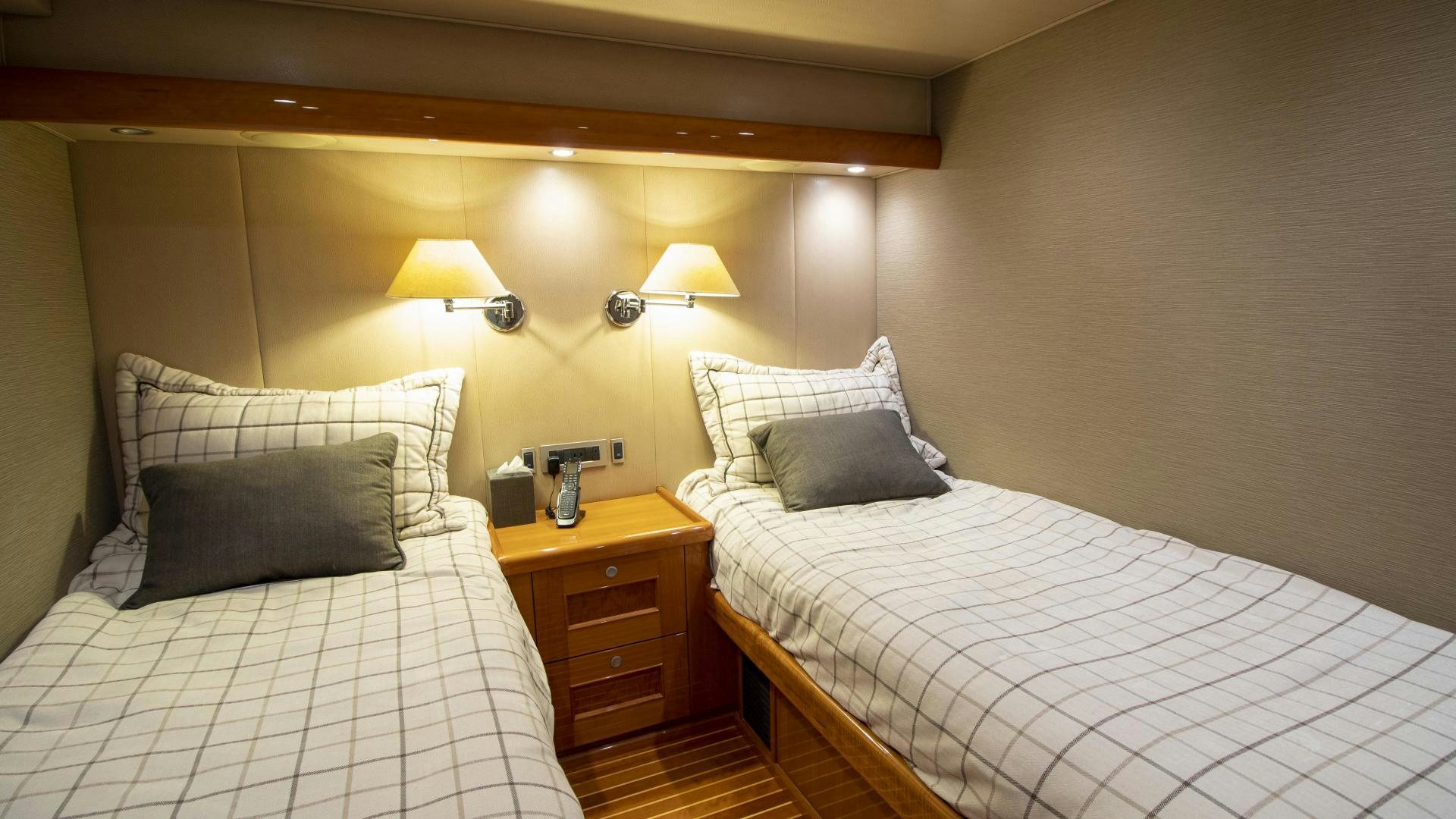 a couple of beds in a hotel room aboard VICTORY Yacht for Sale