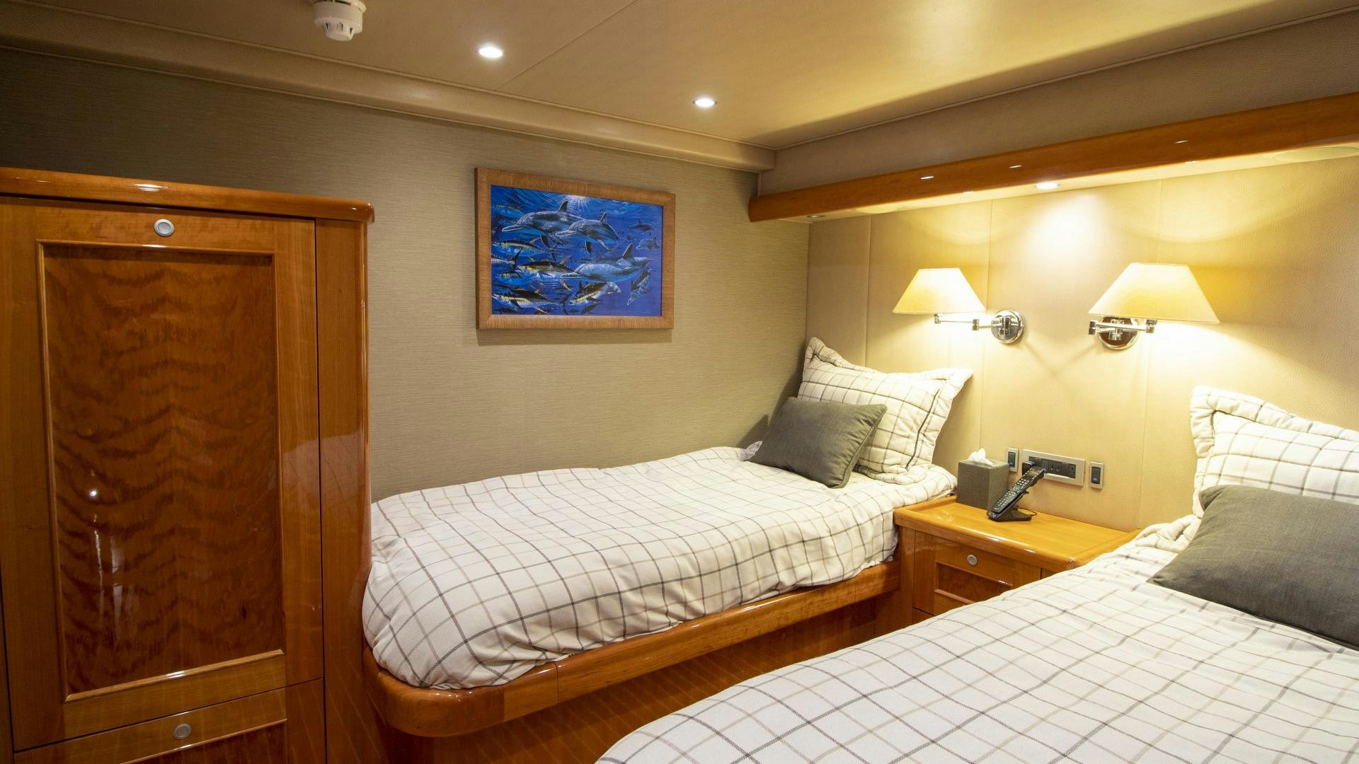 a hotel room with two beds aboard VICTORY Yacht for Sale