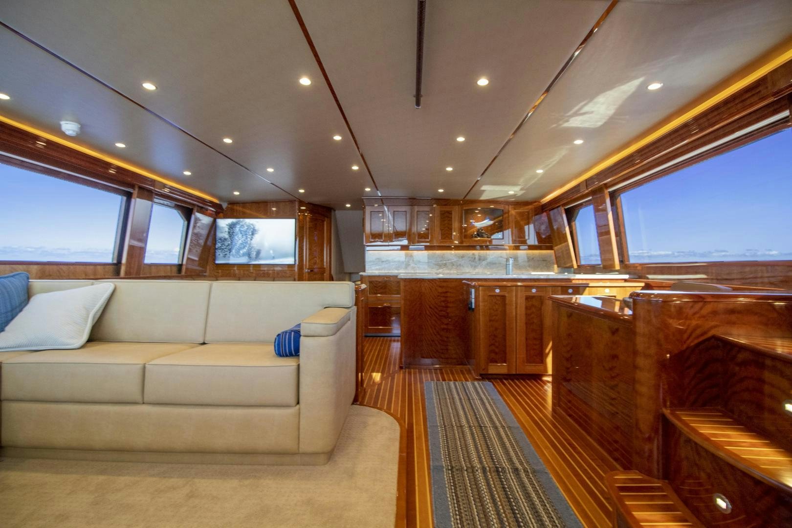 a living room with a couch and a large window aboard VICTORY Yacht for Sale
