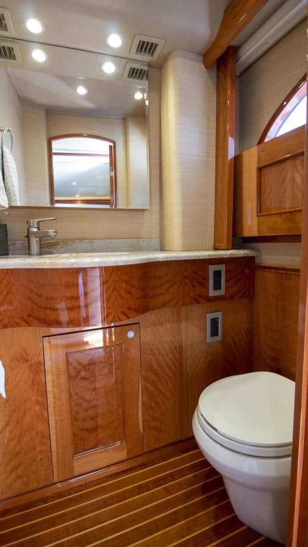 a bathroom with a glass shower aboard VICTORY Yacht for Sale