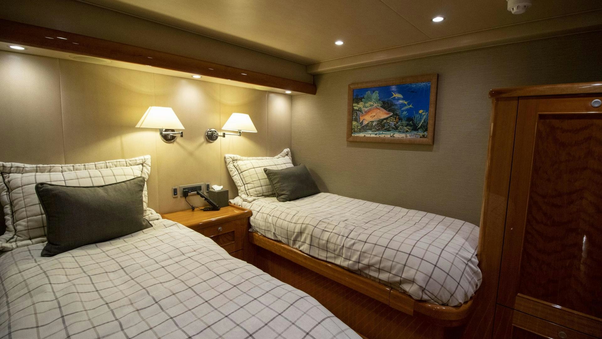 a hotel room with two beds aboard VICTORY Yacht for Sale