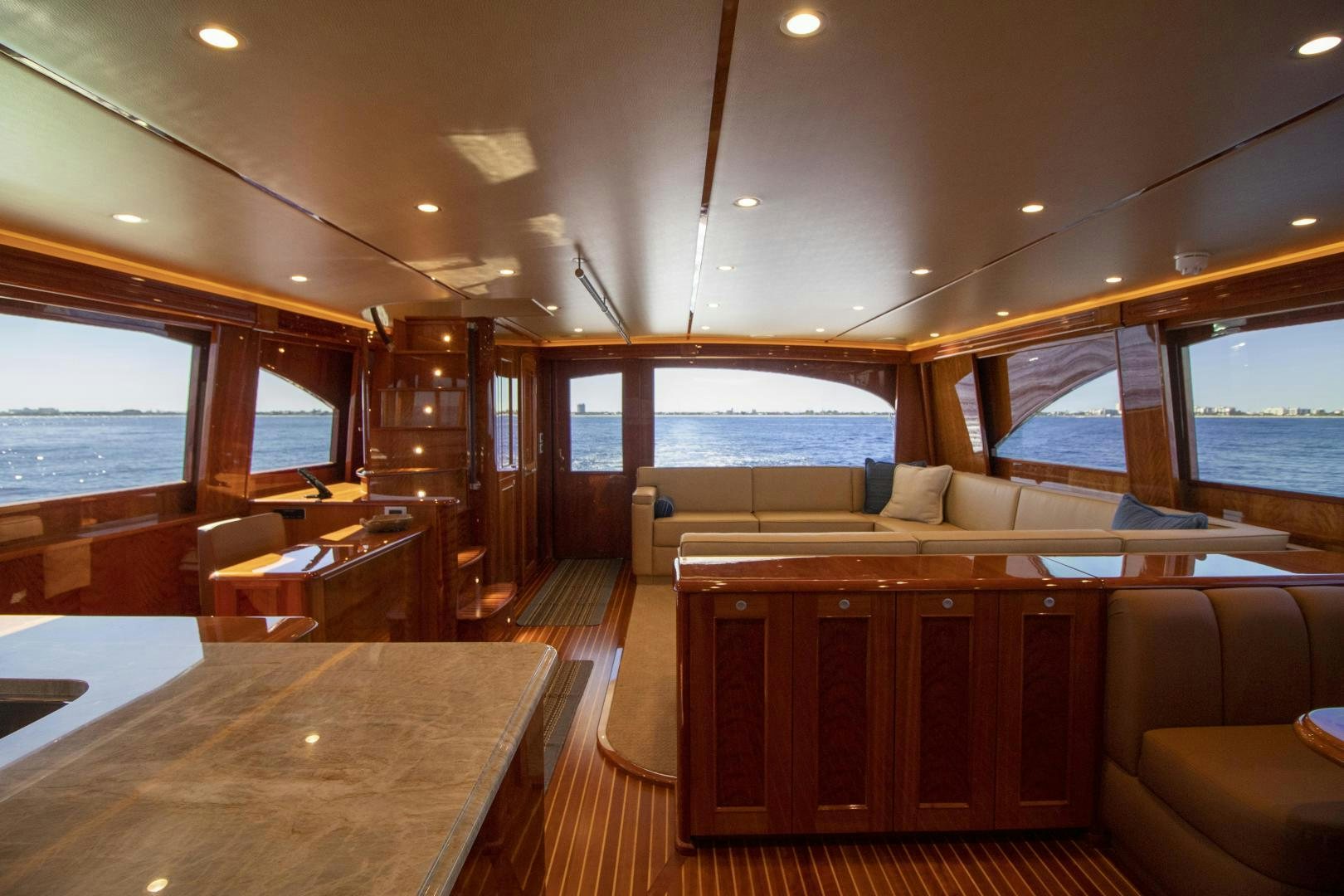 a room with a table and chairs aboard VICTORY Yacht for Sale