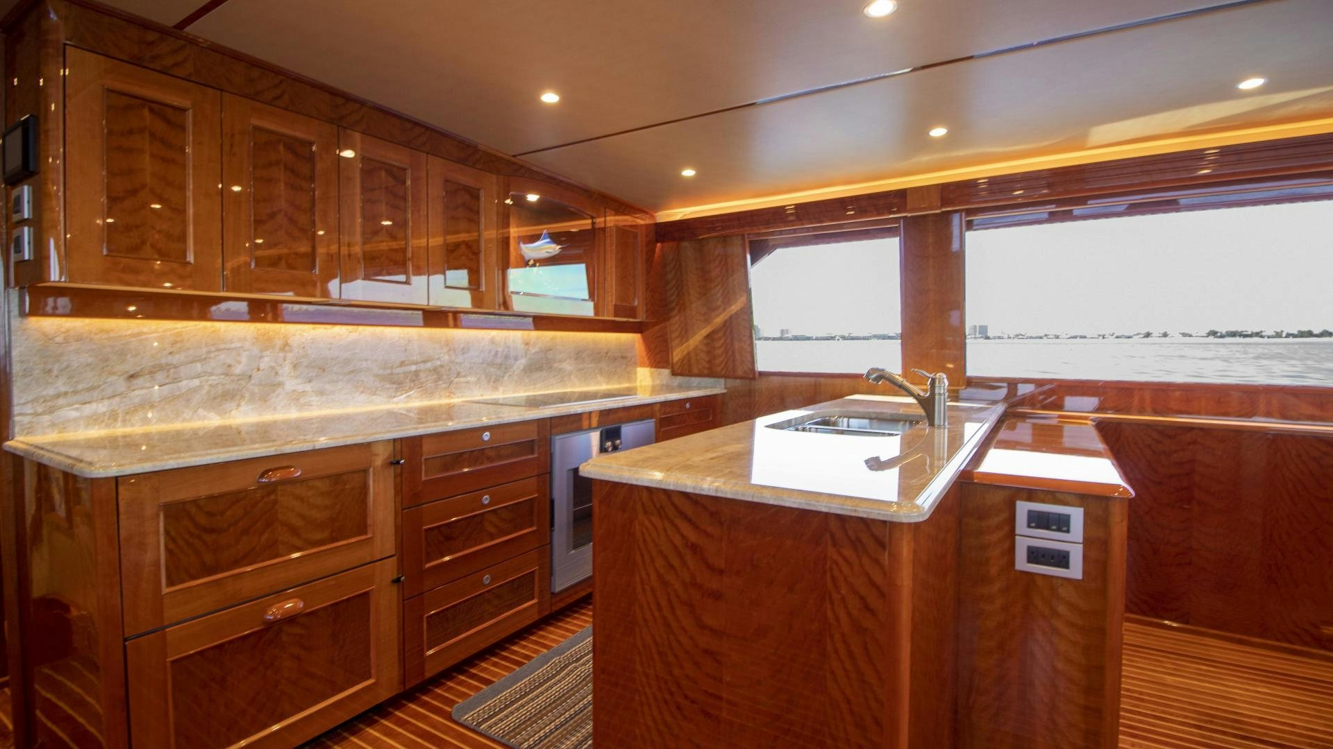 a kitchen with wooden cabinets aboard VICTORY Yacht for Sale