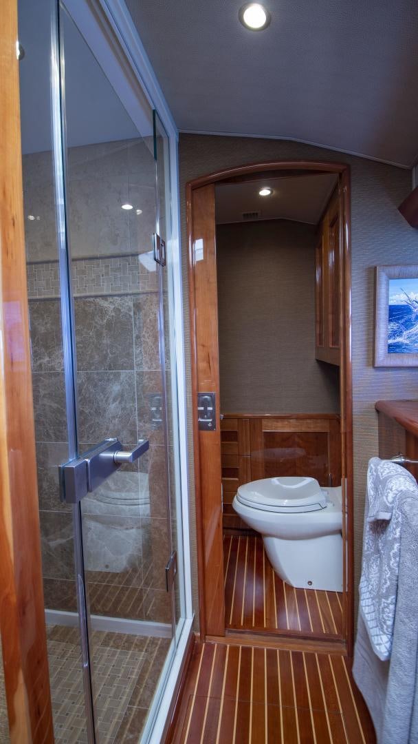 a bathroom with a glass shower aboard VICTORY Yacht for Sale