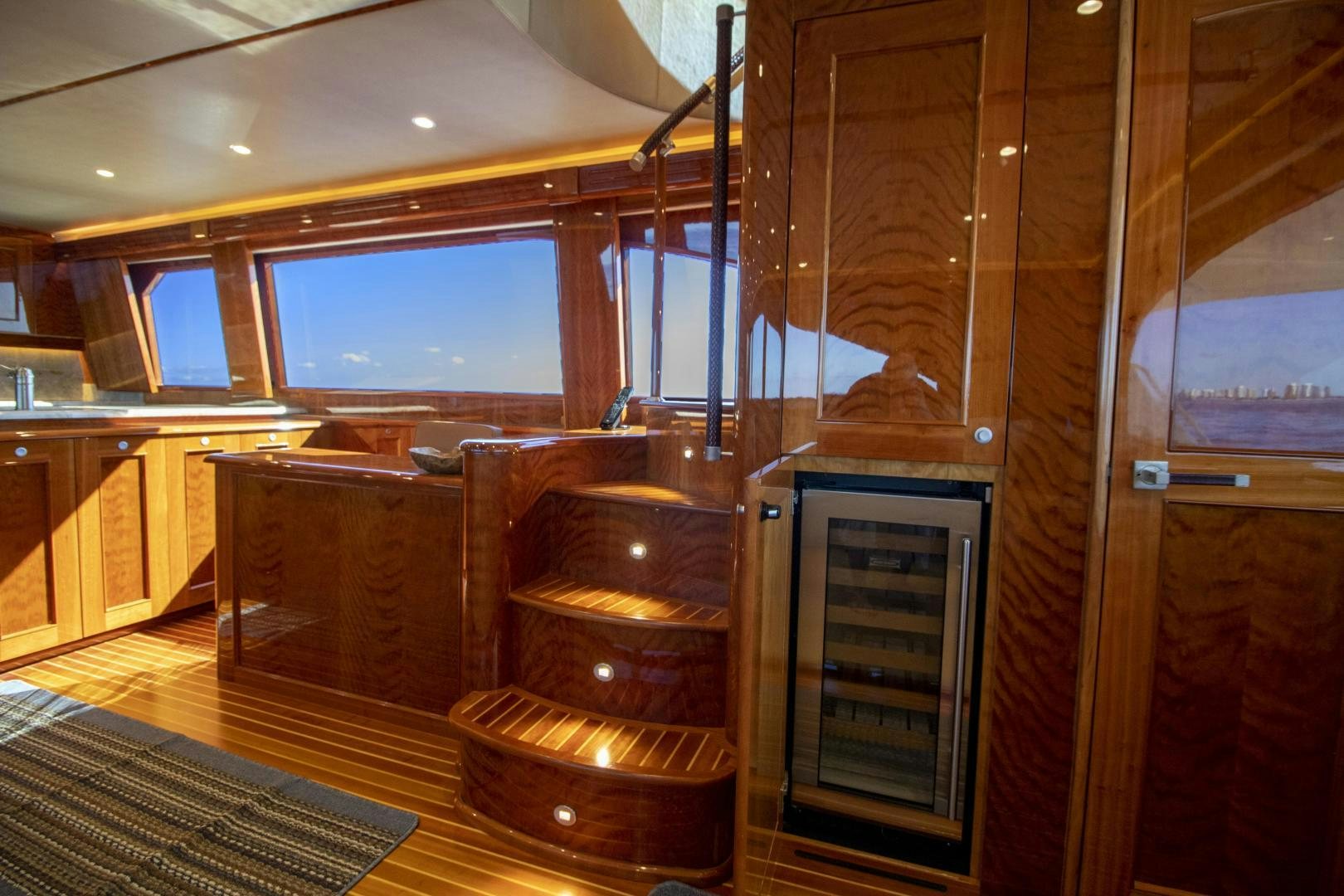a kitchen with wooden cabinets aboard VICTORY Yacht for Sale