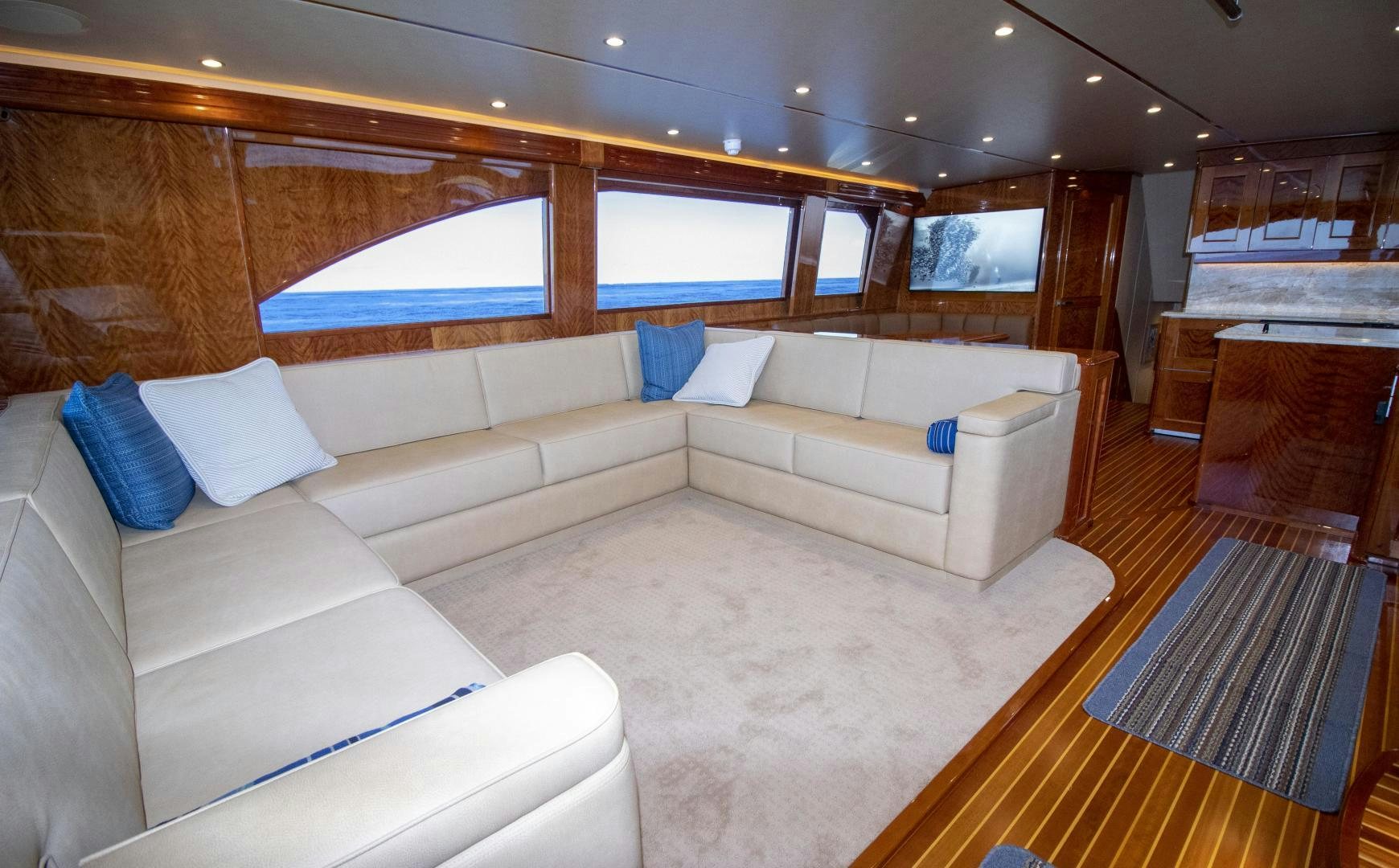 a room with a couch and a tv aboard VICTORY Yacht for Sale