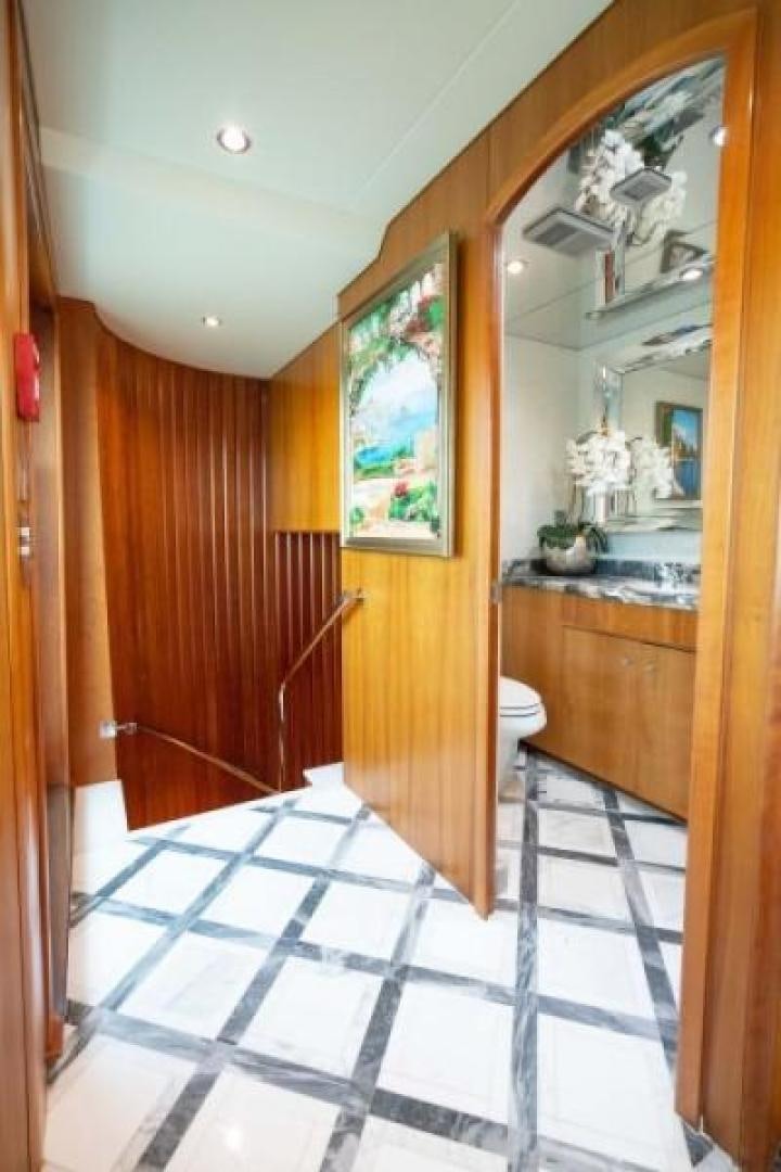 a bathroom with a glass shower door aboard DANIELLE Yacht for Sale