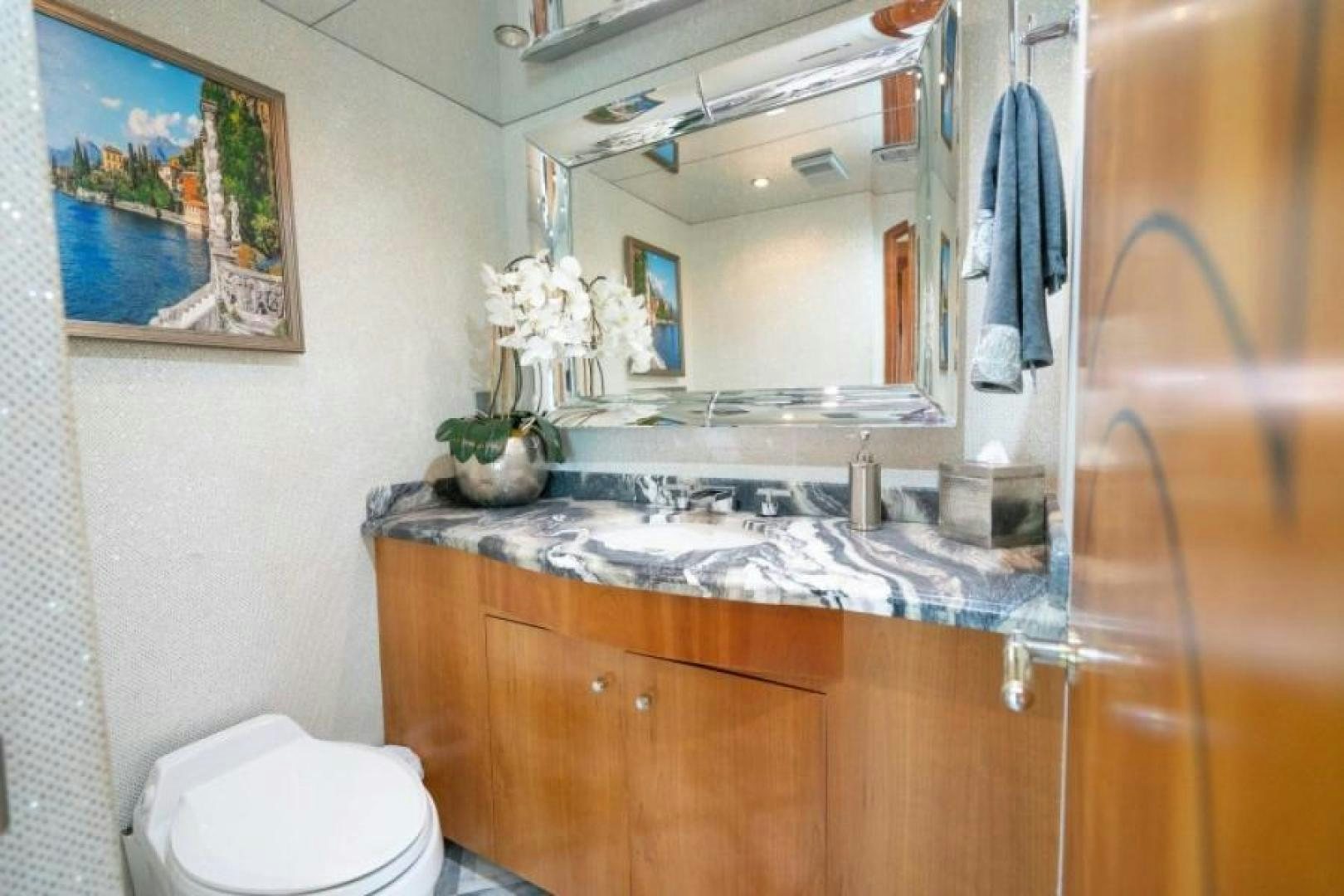 a bathroom with a sink and a mirror aboard DANIELLE Yacht for Sale