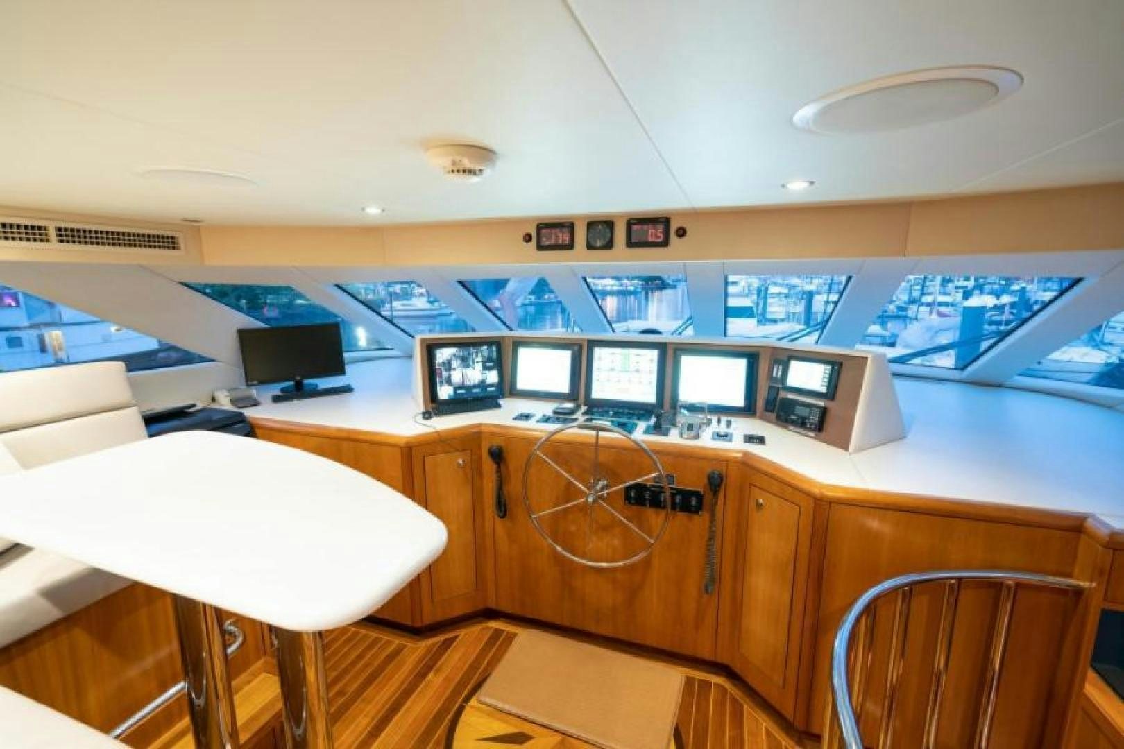 a room with computers and monitors aboard DANIELLE Yacht for Sale