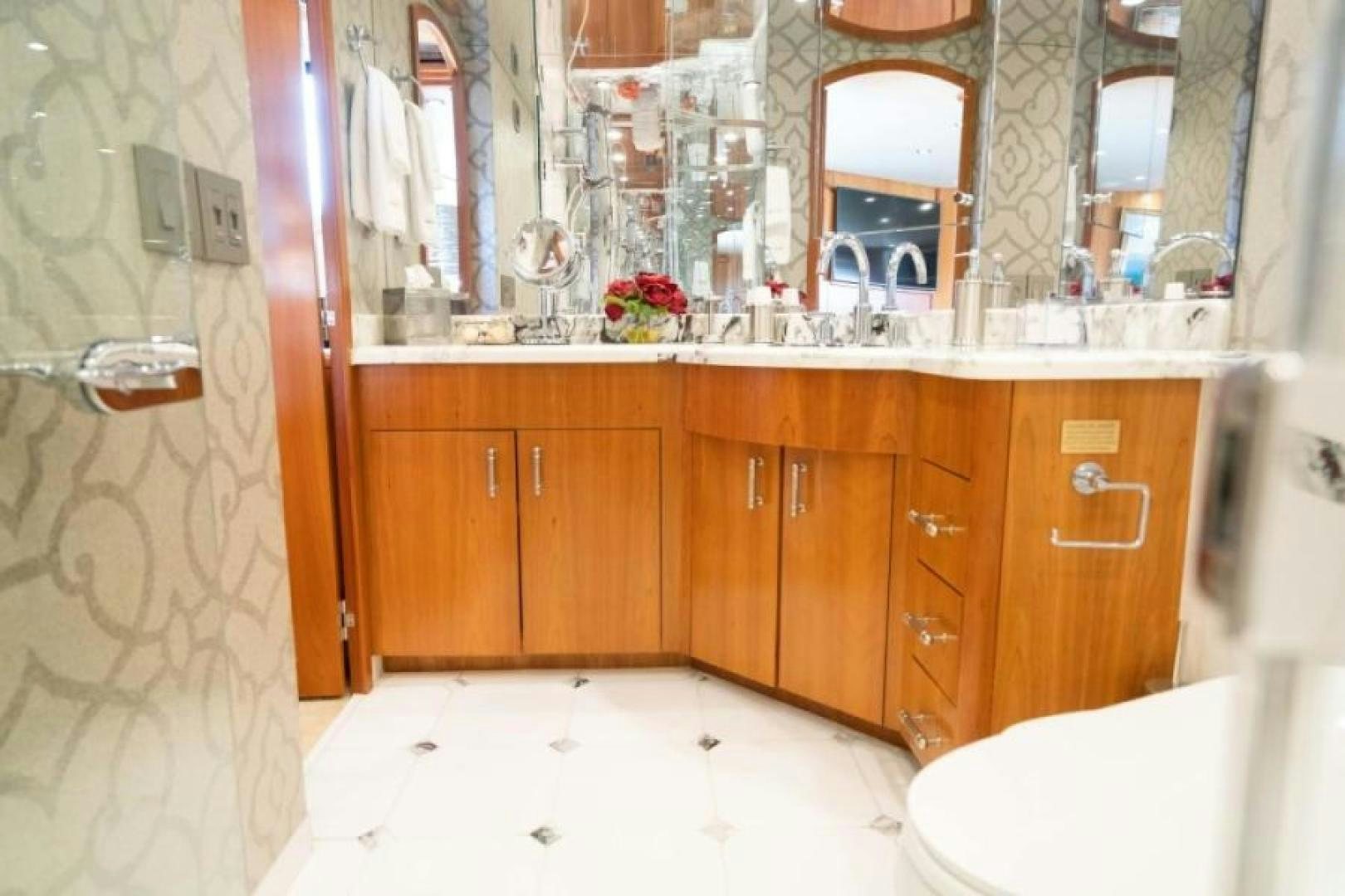 a bathroom with a sink and cabinets aboard DANIELLE Yacht for Sale