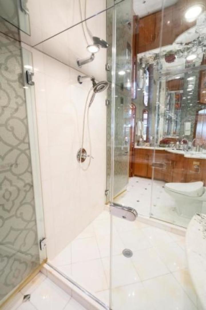 a bathroom with a shower and a sink aboard DANIELLE Yacht for Sale