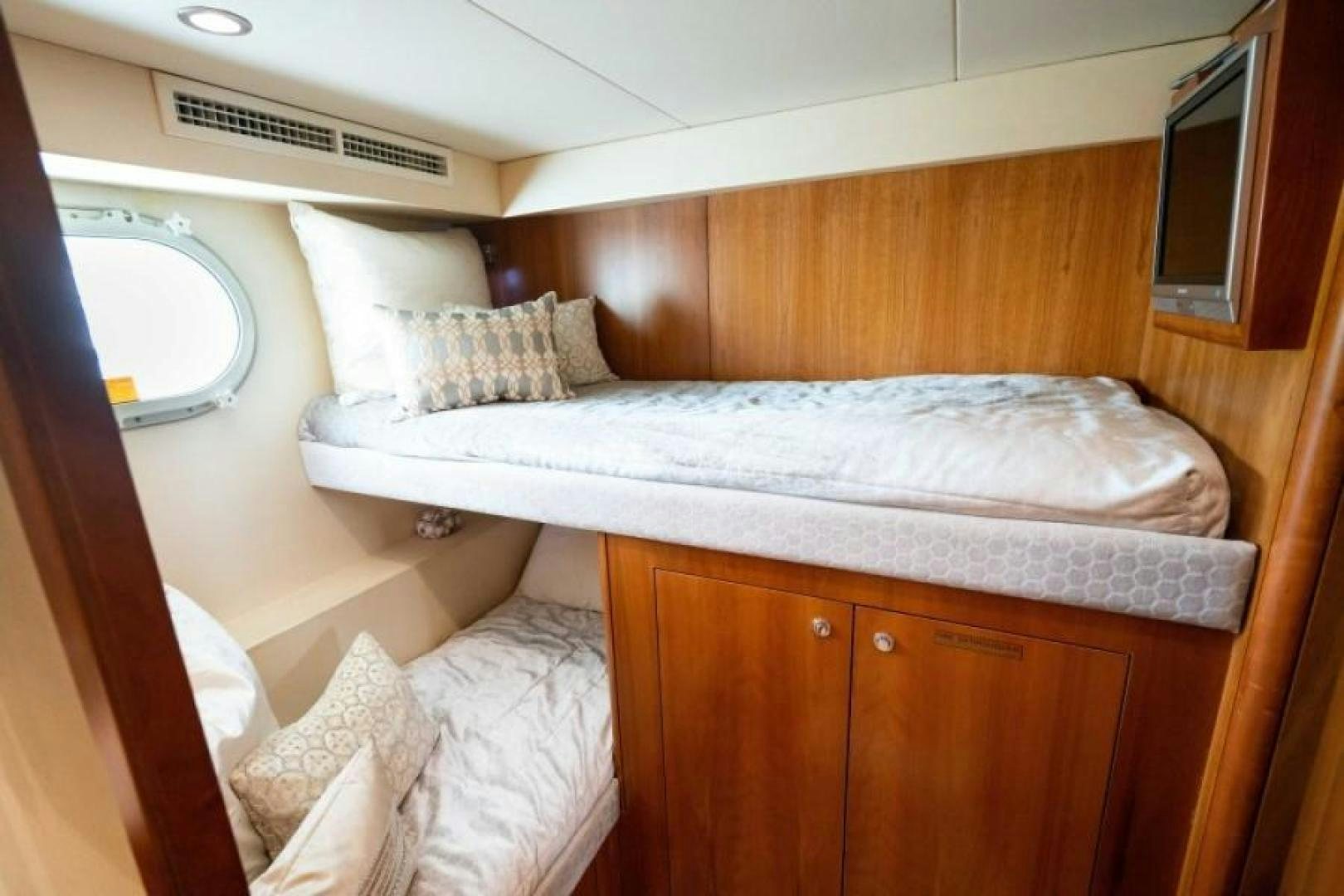 a bed with white sheets aboard DANIELLE Yacht for Sale