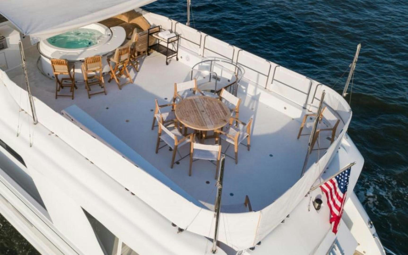 a boat with a flag on it aboard DANIELLE Yacht for Sale