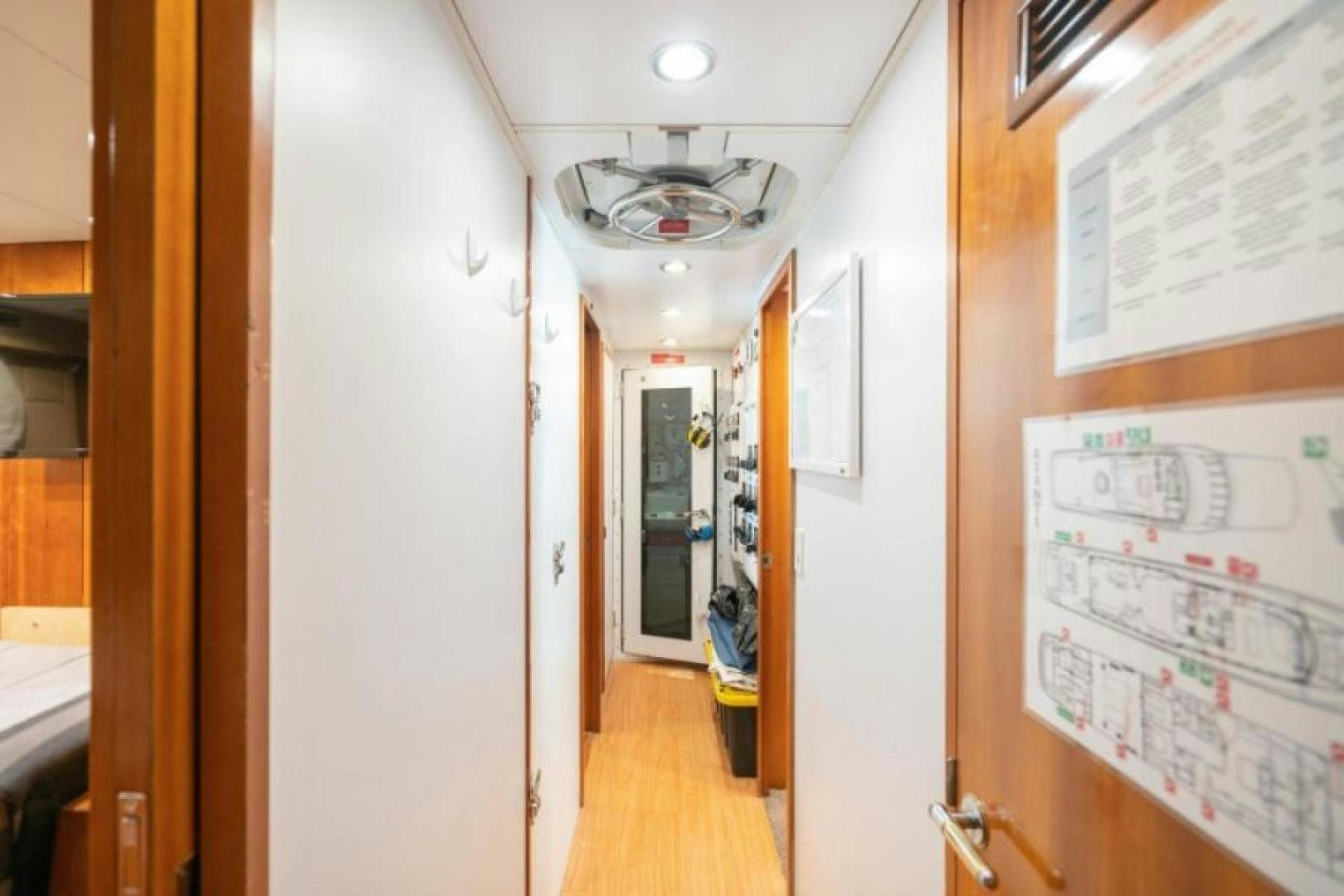 a hallway with a door and a ceiling fan aboard DANIELLE Yacht for Sale