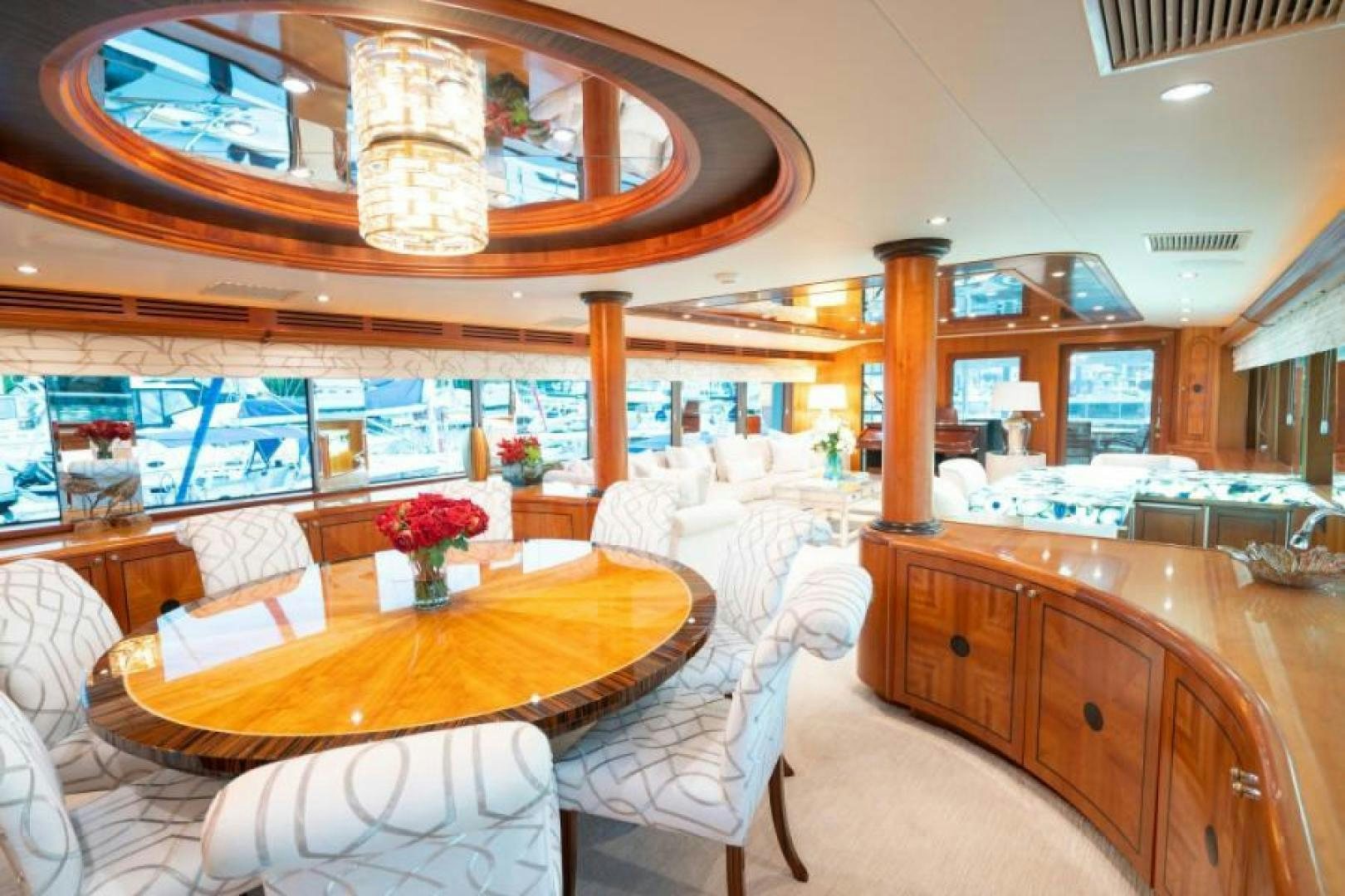 a large room with a table and chairs aboard DANIELLE Yacht for Sale