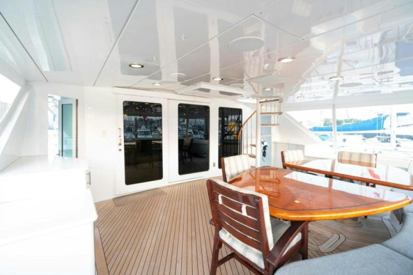 a room with a table and chairs aboard DANIELLE Yacht for Sale