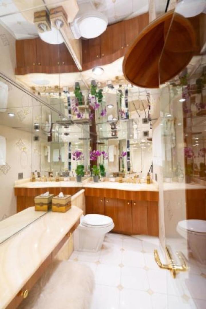 a bathroom with a shower curtain aboard DANIELLE Yacht for Sale