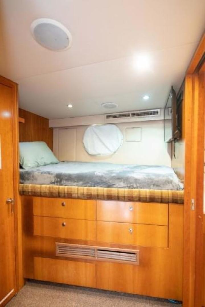 a bed with a white canopy aboard DANIELLE Yacht for Sale