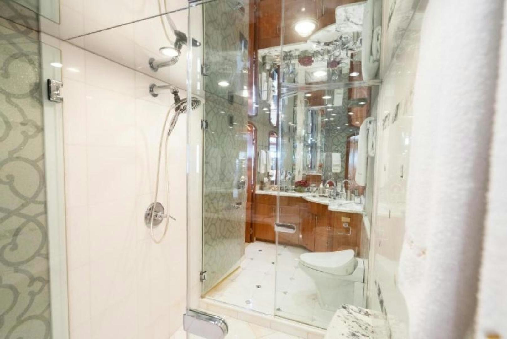 a bathroom with a shower and toilet aboard DANIELLE Yacht for Sale