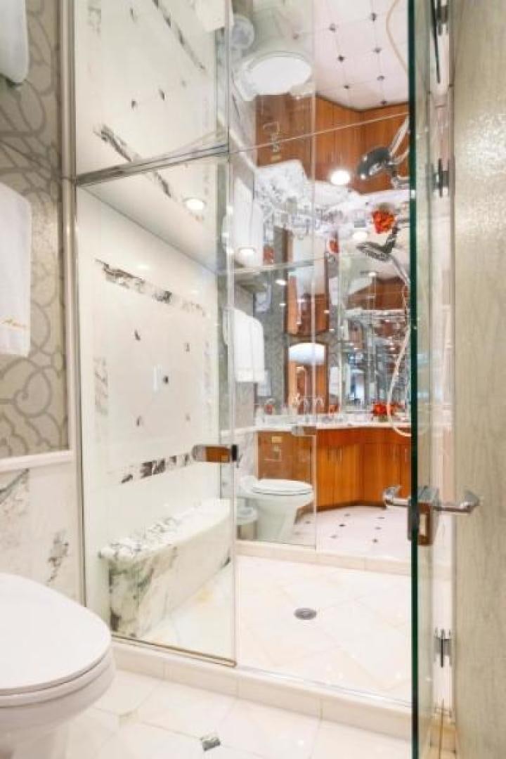 a bathroom with a shower and toilet aboard DANIELLE Yacht for Sale
