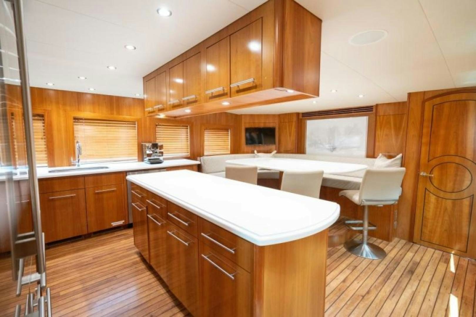 a kitchen with wooden cabinets aboard DANIELLE Yacht for Sale